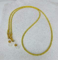 Beautiful Gold handmade eyeglass chain, made with 11/0 glass beads. The length is about 33 inches strung on bead wire with two eyeglass holders on the end. If you have any questions please don't hesitate to ask Beaded Eyeglass Chain, Glasses Chains, Jewelry Sale, Eyeglass Chain, Glasses Chain, Eye Wear Glasses, Chain Gold, Silver Cuff Bracelet, Silver Cuff