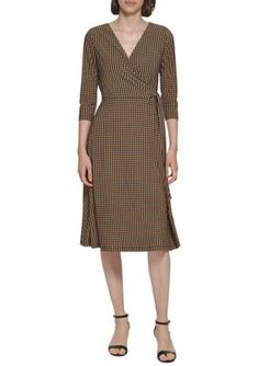 The wrapped silhouette of this Tommy Hilfiger dress flatters any figure while a classic houndstooth print adds immeasurable charm. | Tommy Hilfiger Women's 3/4 Sleeve Tie Waist Printed Wrap Dress, 10 Knee-length Wrap Dress For Fall Workwear, Fall Workwear Midi Dress, 3/4 Length, Fall Midi Dress For Workwear, 3/4 Length, 3/4 Length Midi Dress For Workwear In Fall, Fitted Wrap Dress For Office In Fall, Elegant Houndstooth Midi Dress For Spring, Elegant Spring Midi Dress With Houndstooth Pattern, Elegant Midi Dress With Houndstooth Pattern For Spring, Casual Fitted Wrap Dress For Workwear