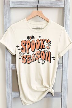 SPOOKY SEASON GRAPHIC TEE     Our Shirts are Authentically Designed and Hand Screen Printed for Best Quality    *Process where the ink is dyed into the shirt and graphic will not peel away     -Proudly Hand Pressed in Los Angeles, CA.     -30 Singles. 100% Washed Cotton     -Comfortable and Very Soft    -Style by Rolling up the Sleeves, Tie a Side Knot, Front Tuck...       SIZE AND FIT      *Please refer to the last photo option for measurements    WASHING AND CARE    -Machine Wash with Like Col Spooky Season Tshirt, Cute Halloween Tshirt, Graphic Tees Halloween, Spooky Season Shirt Ideas, Halloween Tshirts Ideas, Cute Ghost Shirt, Spooky Tshirt Ideas, Spooky Season Shirt, Spooky Shirt Ideas