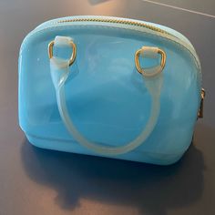 Mini Jelly Handbag From Lily Rain. Never Used. Trendy Light Blue Bag With Detachable Handle, Blue Pouch Shoulder Bag With Top Carry Handle, Blue Handheld Bag With Zipper Closure, Blue Shoulder Bag With Zipper Closure As Gift, Blue Shoulder Bag With Zipper Closure, Ideal As Gift, Light Blue Pouch Bag For Gift, Light Blue Pouch Bag As Gift, Blue Pouch Satchel For Shopping, Chic Blue Pouch Satchel