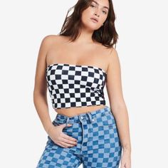 Tommy Hilfiger Speedway Checker Logo Bandeau Crop Top New With Tags Msrp $39.00 Any Questions Please Ask Before Purchasing Will Ship Fast B38 A Figure-Flattering Shape And All-Over Checker Print Make This Speedway Logo Bandeau A Must-Have For The Summer Season. Built From Stretch-Cotton For Comfortable, Breathable Wear. Tommy Jeans Speedway Bandeau Women's Lifestyle Bandeau Checkered Design Tommy Branding At Side Stretch-Cotton Blend For Comfort Colors: Black/White Checker Materials: 95% Cotton Black Strapless Top For Day Out, Strapless Black Tops For Day Out, Casual White Strapless Tube Top, Fitted Tommy Hilfiger Tops For Summer, Casual Strapless Top For Day Out, Trendy Tommy Hilfiger Tops For Spring, Casual Strapless Crop Top For Day Out, Spring Trendy Tommy Hilfiger Tops, Chic Tommy Hilfiger Summer Tops