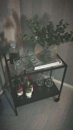 a shelf with glasses and bottles on it