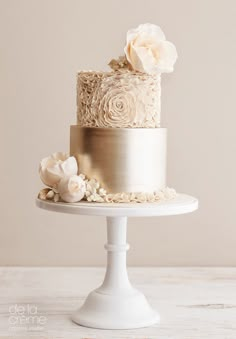 a three tiered cake sitting on top of a white plate