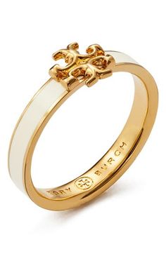 The brand's iconic logo adds a burnished glow to this enameled band that's a perfect fit for your eye-catching stack. Goldtone plate/enamel Imported Tory Burch Ring, Preppy Accessories, Preppy Jewelry, Tory Burch Kira, Jewelry Fashion Trends