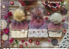 three knitted hats sitting on top of a wooden table next to pink and white flowers