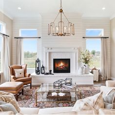 a living room filled with furniture and a fire place in the middle of a room