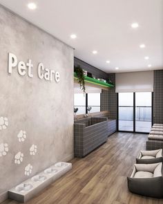 a large room with two couches and a pet care sign on the wall