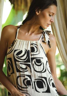 Meet the top-rated summer maxi dress of the season! This sleeveless stunner features a chic ivory and black bohemian print with a relaxed, flowy fit. The tiered hemline adds a playful touch, while the drawstring neckline with adjustable tie lets you customize the look. Perfect for the resort, brunch, beach days, and beyond! No matter where you take it, the Emerson maxi will be your go-to bohemian dress of the season! Bohemian print Relaxed, flowy fit Sleeveless Maxi length Tiered hemline Drawstr Black Bohemian, Maxi Dress Designs, Drawstring Neckline, Bohemian Maxi Dress, Bohemian Print, Beach Maxi Dress, Summer Maxi, Boho Beach, Bohemian Dress