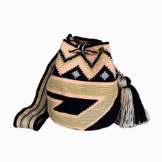 "Wayuu Mochila bag / Crossbody bag / Market Tote / Handmade Summer bag / Beach bag / Woven Boho Handbag Your ultimate summer accessory! This beautiful and unique mochila bag is handwoven by Wayuu artisans from La Guajira, Colombia. It is an ancestral work of art made in a unique weaving technique with a magic needle and Wayuu thread. It is super versatile, which makes it the perfect accessory to be used out in the city or to spend a day at the beach. With its large crossbody strap, you will want Ancestral Work, Summer Bags Beach, Boho Handbag, Mochila Bag, Boho Handbags, Summer Bag, Market Tote, Summer Accessories, Weaving Techniques