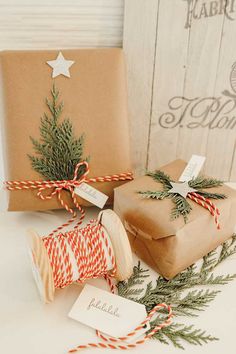 presents wrapped in brown paper and twine tied with red and white striped twine