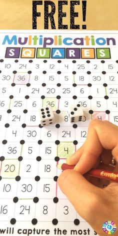 a person is writing on a board with numbers and pencils in front of it