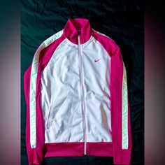 White And Pink Full-Zip Nike Jacket. Never Worn. White Track Jacket With Zipper For Spring, White Track Jacket For Spring, White Zipper Track Jacket For Winter, White Track Jacket With Zipper For Sports, White Spring Track Jacket With Zipper, Nike Casual Outerwear With Zipper Closure, Casual Nike Outerwear With Zipper Closure, White Track Jacket With Zipper Closure For Fall, Casual Pink Nike Windbreaker