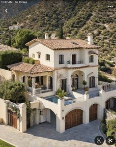 an aerial view of a large home in the hills