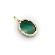 This is part of Chairish’s Fine Jewelry assortment.  Part of our signature collection, we bezel set a malachite in 14k gold to create an oval-shaped pendant. When working with malachite—a green gemstone known for its beautiful layers—we search for pieces with something special about their patterning or symbolism. This one has concentric circles that draw you in as you look at the stone.   Malachite is healing stone connected to the heart chakra. It opens the heart to transformation and unconditional love, and can be used for strength and courage during times of change. It is also said to absorb negative energy and offer protection from energies and pollutants in the environment.   The pendent measures 1” x 3/4”, with an additional 5 x 8 mm bail. It weighs 6.3 grams. Unmarked, but acid test Green Oval Jewelry With Bezel Setting, Yellow Gold Emerald Cabochon Jewelry, Oval Malachite Jewelry In Yellow Gold, Green Fine Jewelry With Smooth Bezel, Yellow Gold Oval Pendant With Cabochon, Formal Oval Malachite Jewelry, 14k Gold Bezel Set Oval Pendant Jewelry, Yellow Gold Malachite Pendant Jewelry, Green Oval 14k Gold Jewelry