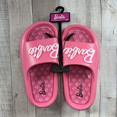 Barbie Women's Mattel Beach Slides Sandals Slip-On Logo Pink Size 6 New With Tag. Sandals In Photos Are The Exact One You Are Purchasing. Please Examine The Photos Entirely As They Are Part Of The Details. -Size: 6 -Color: Pink -Slip-On -Rubber Outsole Due To Variations In Phone Displays Or Computer Monitor Settings And The Light Brightness When Taking Photos, The Real Color Of The Item May Be Slightly Different From The Photos Shown. Message Me If You Have Any Questions! All Items Are Shipped T Open Toe Eva Sandals For Beach Season, Pink Eva Sandals For Beach Season, Spring Beach Sport Sandals Made Of Eva, Pink Round Toe Slippers For Summer, Comfortable Pink Summer Slippers, Casual Pink Summer Slippers, Pink Slide Flip Flops For Summer, Pink Eva Sandals For Vacation, Pink Eva Slippers For Summer