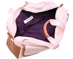 the inside of a pink and brown purse with straps on it's sides, including an inner pocket