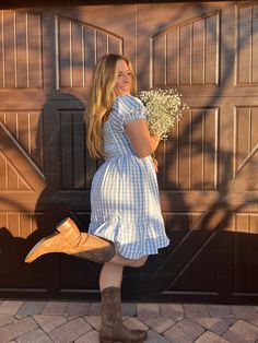 The "Fenceposts" mini dress is perfect for the spring and summer seasons. With a baby blue gingham dress its perfect for as fourth of July bbq or if you want to follow the yellow brick road. Pairs cute with heels or cowgirl boots! -double lined dress -side zipper for easy dressing -ruffled bottom -elastic smocked back for comfortable wear *Model is 5'2 bra size 34DD wearing size Medium* Fourth Of July Bbq, Follow The Yellow Brick Road, Blue Gingham Dress, The Yellow Brick Road, Dresses With Cowboy Boots, Cowboy Aesthetic, Blue Plaid Dress, Brick Road, Yellow Brick Road