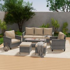 an outdoor living area with furniture and trees