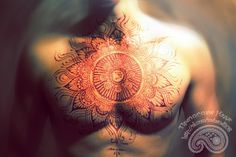 a man's chest with an intricate design on it