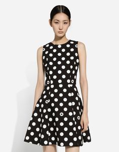 Short cotton rush-stitch brocade dress with polka-dot print: Black and White Sleeveless Partially lined in stretch silk Rear zipper and hook-and-eye fastening The piece measures 48 cm from the waist down on a size IT 40 The model is 175 cm tall and wears a size IT 40 Made in Italy The difference in the print placement that you may find on this product is a feature of Dolce & Gabbana’s “Handmade” pieces. A detail that makes every garment or accessory unique and exclusive. Chic A-line Polka Dot Dress, Chic Fitted Polka Dot Dress, Polka Dot Sleeveless Evening Dress, Elegant Mini Dress With Polka Dot Pattern, Polka Dot Evening Dress For Spring, Polka Dot Sleeveless Lined Dress, Sleeveless Polka Dot Formal Dress, Spring Evening Mini Dress With Polka Dot, Sleeveless Polka Dot Dresses For Formal Occasions