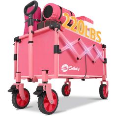 a pink toy wagon with wheels and lights on the front, sitting in front of a white background