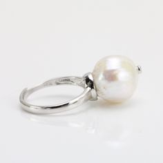 The ring is made of large size freshwater baroque pearls with 14-15mm large size white baroque pearl,and i embed the rhinestone on the pearl top to make it more special. what' most important , it is so affordable price, Item No: RIN049 Item:genuine freshwater pearl ring Pearl shape:near round baroque pearl Pearl size:around 13-14mm Pearl color: white Pearl skin:clean, Pearl luster: good Pearl quality: AA+ Metal: sterling silver 925 Embed Accessory: rhinestone with silver 925 Ring size:suitable f Elegant Silver Rings With Baroque Pearl, Elegant Silver Baroque Pearl Rings, Pearl Top, Ring Pearl, Freshwater Pearl Ring, Baroque Pearl Earrings, Purple Pearl, 925 Ring, Pretty Earrings