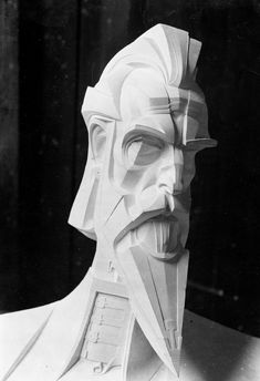 a paper sculpture of a man wearing a helmet