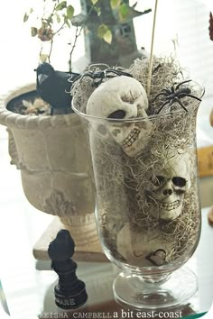 there is a vase with fake skulls in it