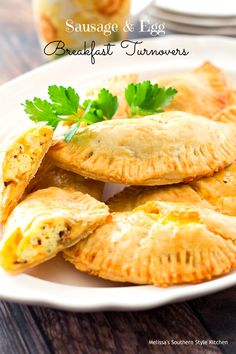 sausage and egg breakfast turnovers on a white plate