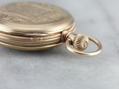 This antique pocket watch dates to 1885 and is in excellent condition! Ornately engraved on the antique rose gold case is a "C" monogram. This is a 6 Size watch, bearing a fine 11 Jewel movement. The face is handsome and elegant. Movement Size: 6 Size Movement Type: Waltham Setting Method: Stem Jewel Count: 11 Jewel Year of Manufacture: 1885 Country of Origin of Movement: USA Country of Origin of Case: USA Condition of Movement: Running and Keeping Time Well Case Material: 14K Antique Rose Gold C Monogram, Antique Pocket Watch, Vintage Clocks, Gold Pocket Watch, Clock Repair, Usa Country, Pocket Watch Antique, Cameo Ring, Rose Gold Case