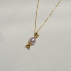 Our Sweet Treat necklace features a candy charm made with freshwater pink lavender pearls. Satisfy your cravings while looking stylish. (Don't worry, they're not just for kids!) Details - 9-10mm pink lavender baroque pearls. - Each baroque pearl is unique and different, we carefully select the baroque pearls but shapes and pearl sizes may vary. - 14k gold filled chain, gold vermeil candy charm. Wanna browse more of my necklace series? https://www.etsy.com/ca/shop/PrettyPearlfect?section_id=31790 Pink Pearl Charm Pendant Necklaces, Pink Pendant Necklaces With Pearl Charm, Pink Pearl Pendant Necklace For Gift, Elegant Pearl Charm Necklace For Birthday, Elegant Pink Round Charm Necklace, Elegant Pink Round Charm Necklaces, Sweet Silver Necklace Perfect For Gifts, Pink Necklaces With Pearl Charm For Gifts, Pink Necklaces With Pearl Charm As Gift