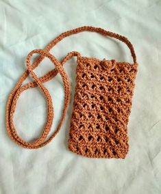 Elevate your accessory game with our Raffia bag. Whether you're heading to the beach, going for an outdoor adventure, or simply need a stylish mobile holder, this versatile bag has got you covered. Plus, it makes for a thoughtful and unique gift, as every piece is meticulously crafted by hand. Dimension Height 18 cm Width 11 cm Travel Crochet Crossbody Bag With Cell Phone Pocket, Casual Beach Phone Bag With Cell Phone Pocket, Casual Phone Shoulder Bag For The Beach, Casual Shoulder Phone Bag For Beach, Casual Shoulder Phone Bag For The Beach, Casual Beach Shoulder Phone Bag, Brown Phone Bag For Everyday Summer Use, Brown Phone Bag For Summer Everyday Use, Casual Brown Phone Bag For Beach