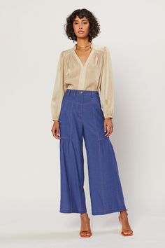 A pair of relaxed, wide-leg pants is an essential for summer dressing. This pair is the perfect addition to your warm-weather wardrobe, done in a classic indigo shade. Marigold topstitching shows off the cool details, from the angled yoke and deep porkchop pockets at the front to the workwear-inspired patch pockets at the back. Gentle shirring accentuates the easy shape. •Wide-leg silhouette •Contrast stitching •Angled yoke •Porkchop pockets •Shirred detailing •Patch pockets at back •Relaxed fit Summer Dressing, Easy Shape, Mommy Style, Secret Pants, Denim Pant, Contrast Stitch, The Cool, Denim Blue, Item Number