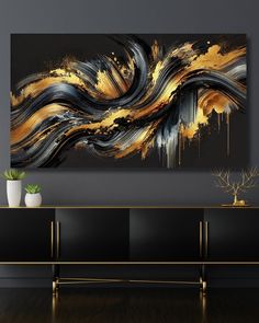 an abstract painting on the wall in a living room with black and gold accents, white vase