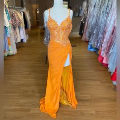 Amelia Couture Dress Style Ago104 Size 0 In The Color Orange. Fitted Gown With Hot Stones And Leg Slit. New With Tags. Now On Sale! 100% Authentic. I Have A Small Boutique Therefore Buy Direct From The Manufacturer. Merchandise Ships Directly Out Of Our In Store Inventory. Blue Sparkly Prom Dress, Lace Bodice Prom Dress, Cut Out Prom Dresses, The Color Orange, Fitted Gown, Fitted Gowns, Sparkly Prom Dress, Blue Evening Gowns, Lace Ball Gowns