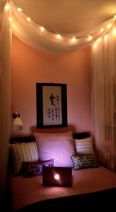 a bedroom with lights strung over the bed