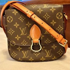 Update: I Have A St Clouds Pm Too-Not Posted Yet. This Louis Vuitton Bag In Amazing Vintage Condition! Finding One In This Condition, Without The Inside Pockets, Peeling And Sticky, Is Almost Unheard Of..Picts Taken At Night, So Look A Little Dark. Full Strap On Highest Buckle Hole For A Shoulder Hip Length To 7 Down To Adjust To The Longest Crossbody. Shoulder Strap Drop Max: 21.25" Shoulder Strap Drop Min: 17.25" Height: 7.0 Width: 7.5" Depth: 2.15 Own A Piece Of Fashion History. Collectible L St Cloud, Monogram Bag, Vuitton Bag, Fashion History, Hip Length, Brown Gold, At Night, Inside Pocket, Louis Vuitton Bag