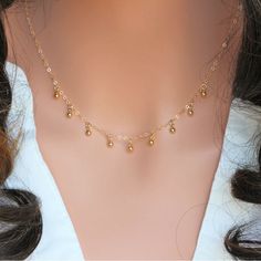 14k gold filled delicate Gold Ball dropnecklace, Perfect looking on its own or layering with other dainty necklaces. All components onto 14k gold fill . ★It makes of.. -14k gold fill 3mm 3D  9 Balls Drop dangle on  -14k gold fill chain with spring claw. -Come up with beautiful ribbon gift box and -One set of Care instruction package that enhance your present, HEARTS  https://www.etsy.com/shop/rainbowearring1/search?search_query=heart+&order=date_desc&view_type=gallery&ref=shop_search LARIATS  https://www.etsy.com/shop/rainbowearring1?section_id=16403349&ref=shopsection_leftnav_1 INFINITY  https://www.etsy.com/shop/rainbowearring1/search?search_query=INFINITY+&order=date_desc&view_type=gallery&ref=shop_search IF you are not sure about chain length or would like to adjust the length of the n Drop Necklace Gold, Gold Drop Necklace, Dainty Necklaces, Ball Drop, Gold Charms, Ball Necklace, Rainbow Earrings, Chain Extenders, Drop In