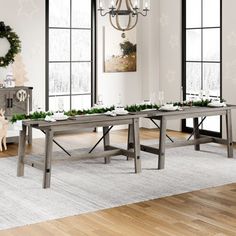 a dining room table set up with christmas decorations