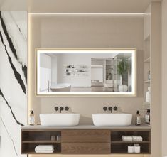 a bathroom with two sinks and a large mirror on the wall above it's counter