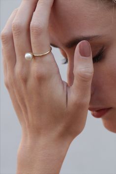 Beautiful and Timeless Ring with a white freshwater pearl, crafted in 14kt yellow gold. A big trend in 2020 - beloved by fashion icons on and off the runways. #klenota #klenotajewelry #ring #klenotaring #pearls #pearlrings #yellowgold #14k#14carat #minimalistic #valentinegift #giftideas #simple #pearls #anniversary #anniversaryrings #freshwaterpearl #pearljewelry
#minimalistic #statement #bestgift Formal Yellow Gold Pearl Rings, Timeless Akoya Pearl Drop Ring, 14k Yellow Gold Rings With Pearl Charm, Fine Jewelry 14k Gold Pearl Drop, 14k Gold Pearl Drop Fine Jewelry, Yellow Gold Akoya Pearl Ring, Formal Gold Rings With Akoya Pearl, 14k Gold Moonstone Open Ring, Timeless 14k Gold Moonstone Ring