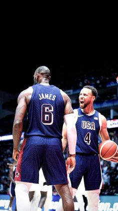 two basketball players standing next to each other