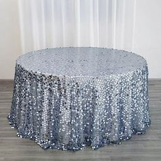 a round table with silver sequins on it