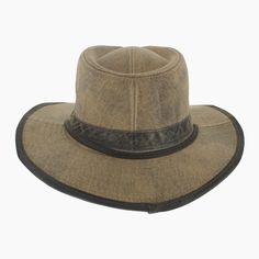 'The Buckthorn is well suited to the adventurous soul who craves a rugged hat for outdoor exploring. Made of waxed cotton that repels moisture, the Buckthorn is an outback safari style that features a vented modified teardrop crown for air flow. Trimmed with a faux leather hat band and matching brim edging, this sturdy hat will stay in place with its adjustable chin strap. Lightweight and pliable, the wide brim offer a hidden wire along the edge that can be hand shaped to meet your needs. *Exclu Brown Waxed Brimmed Hats, Brown Waxed Finish Hats, Rugged Hunting Hat With Curved Brim, Rugged Flat Brim Hunting Hat, Distressed Brown Fedora For Outdoor, Vintage Outdoor Hat For Fall, Vintage Hats For Outdoor Fall Use, Classic Distressed Brown Hat For Outdoor, Vintage Fall Hat For Outdoor