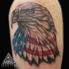 an eagle with the american flag painted on it's back half - sleeve tattoo