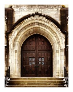 an old church door with steps leading up to it