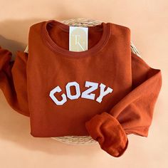 Cozy up with our Cozy Crewneck Sweatshirt this fall season! - Sweatshirt is super soft and comfy! ♡ - Sweatshirt composition: 50% cotton, 50% polyester - All our sweatshirts run a unisex fit. They are naturally oversized, so we normally recommend your true size. But if you like a more baggy look, we recommend sizing up. - These letters are iron-on patched and is heat pressed, not embroidered. But rest assured they've been tested and won't fall off! - Please note that crewneck brand used may vary Fall Crewneck, Fall Graphic, Fall Sweater, Winter Sweatshirt, Halloween Sweatshirt, Fall Sweatshirt, Cozy Sweater, Cozy Sweatshirts, Fall Sweaters