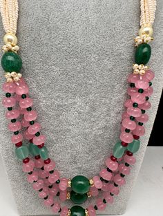 Pink Pumpkin Beads and Green Beads Multi Layer Necklace Only Neckalce no earringsColor : GoldenSize : Necklace Length : 22 Inches Approx;Stones : Pearl Real Emeralds Rose Quartz Nakshi Balls Pink Round Beads Jewelry For Festivals, Party Beaded Necklaces With Gemstone Beads, Party Gemstone Beaded Necklaces With Round Beads, Pink Beaded Jewelry For Festive Occasions, Festive Beaded Necklaces With Colorful Oval Beads, Pink Beaded Necklace With Polished Beads For Festivals, Festive Oval Beaded Necklaces With Colorful Beads, Festival Gemstone Beaded Necklaces, Round Gemstone Beads For Party