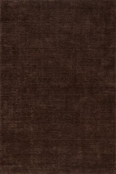 an area rug with dark brown colors