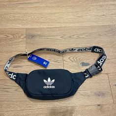 Brand New Dark Grey Fanny Pack From Adidas. Has Two Pockets And Adjustable Waistband. Great For Travel, Going Out, Etc. Can Be Worn As A Cross Body As Well! Casual Bags With Logo Strap, Adidas Bags, Adjustable Waistband, Grey Adidas, A Cross, Fanny Pack, Adidas Women, Cross Body, Crossbody Bags